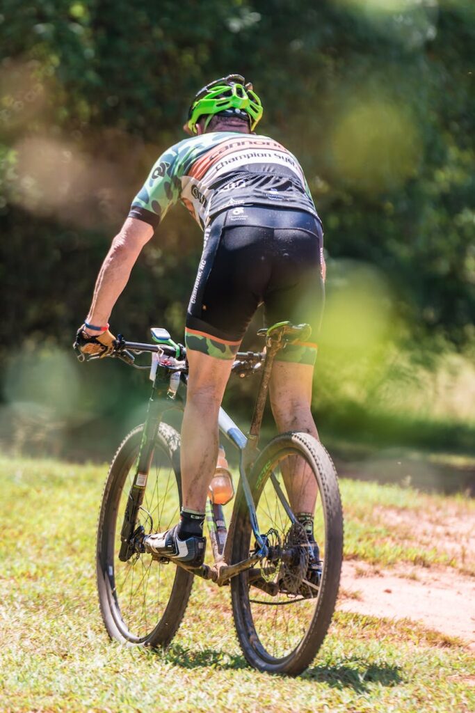 photo of person riding bicycle